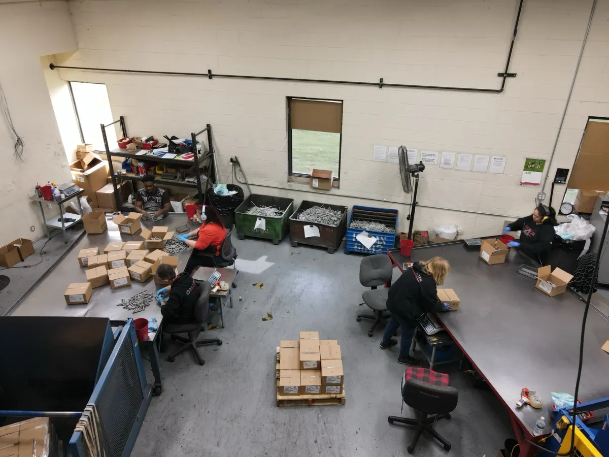 Sort-Tek team inspecting and sorting fasteners